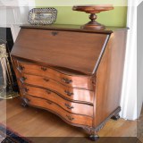 F50. Slant top serpentine front desk. 31”h x 33”w x 15”d - $95 